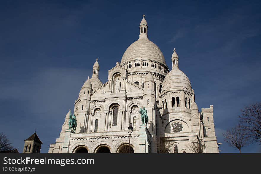 The church of Sacrecoueur in a clear blue sky. The church of Sacrecoueur in a clear blue sky