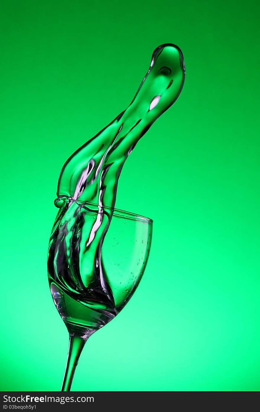 Water splashes out of water glass