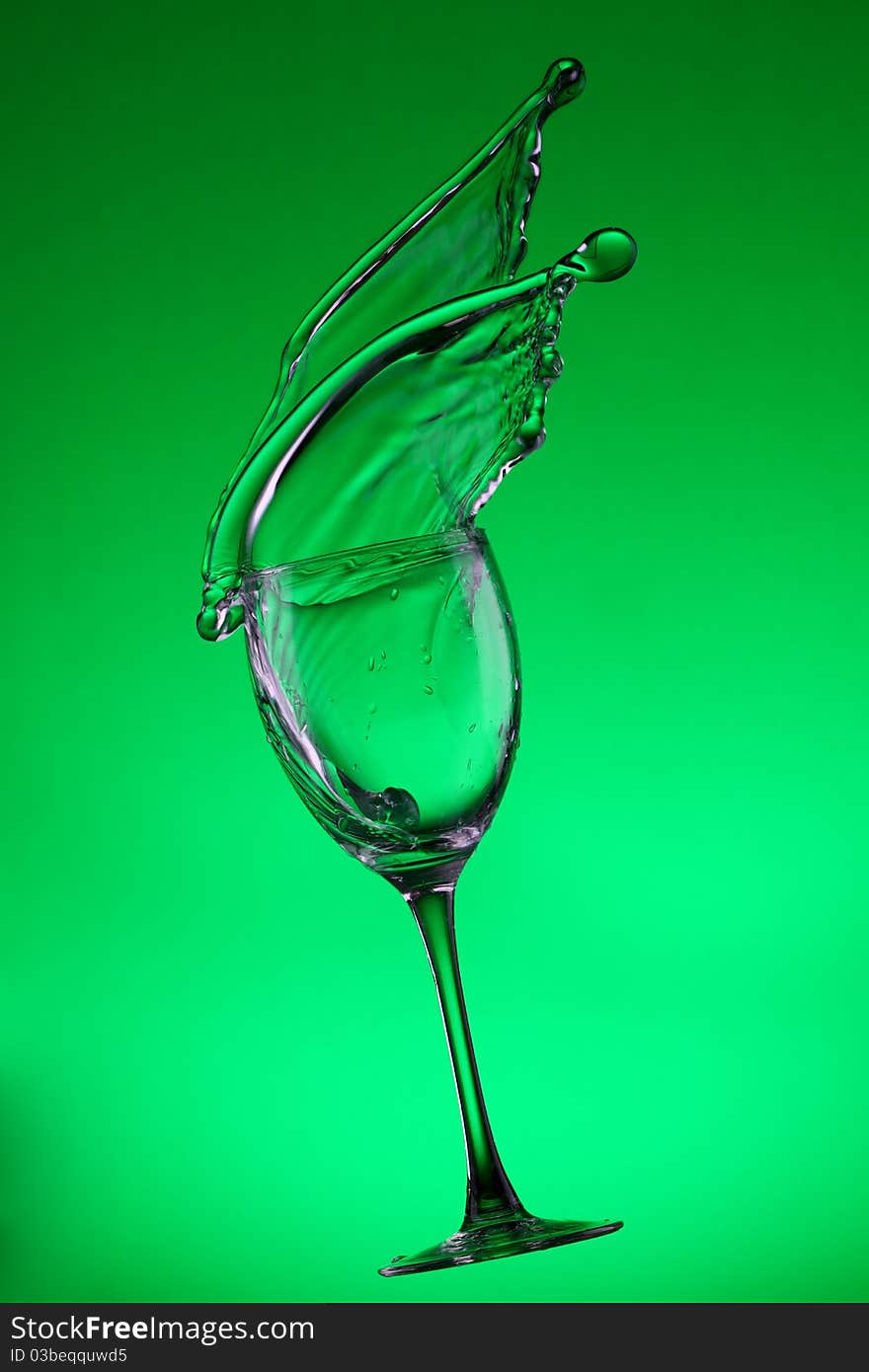 Water splashes out of water glass