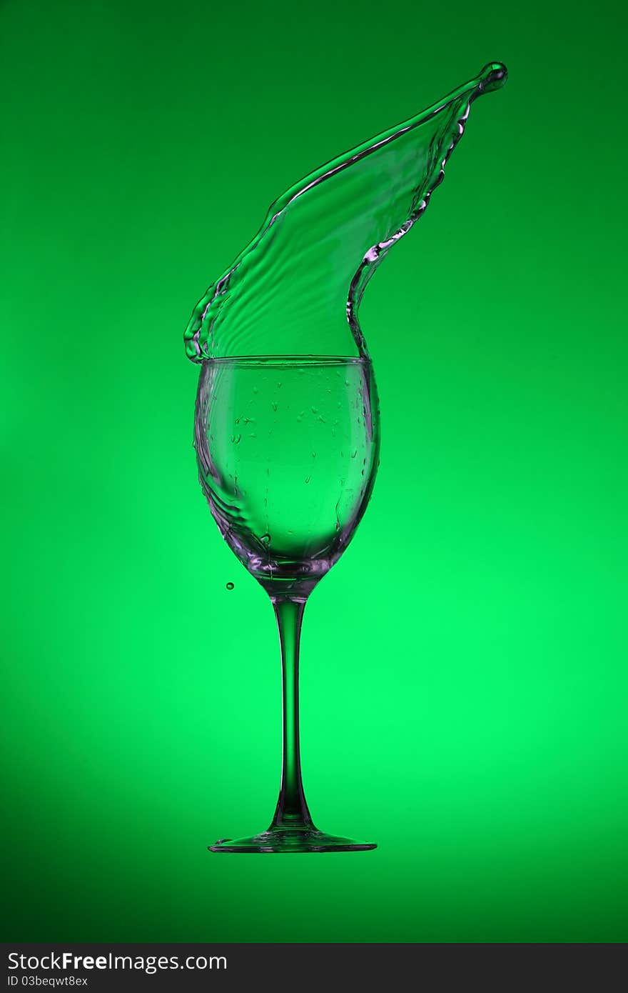 Water splashes out of water glass