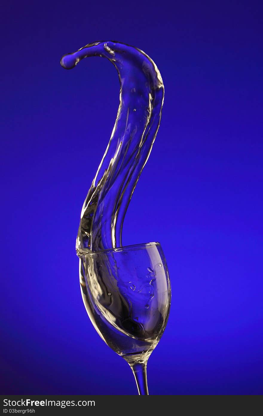 Water splashes out of water glass