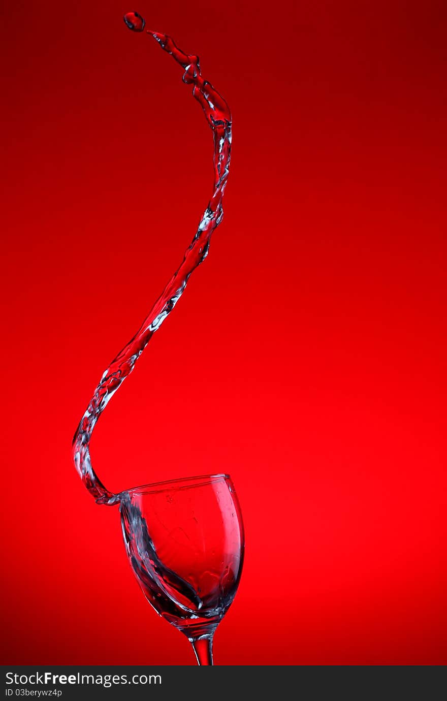 Water splashes out of water glass