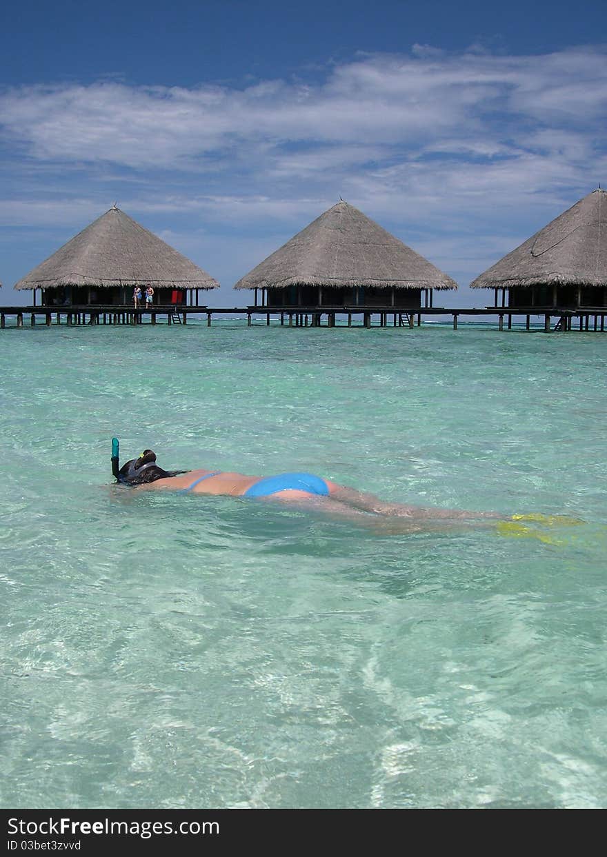 Beautiful girl snorkelling at maldives