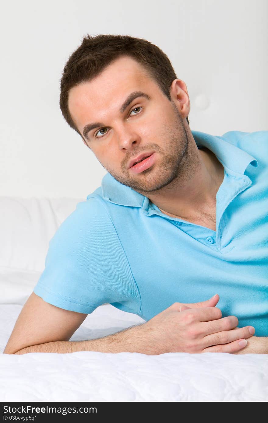 Young man lying on the bed. Young man lying on the bed