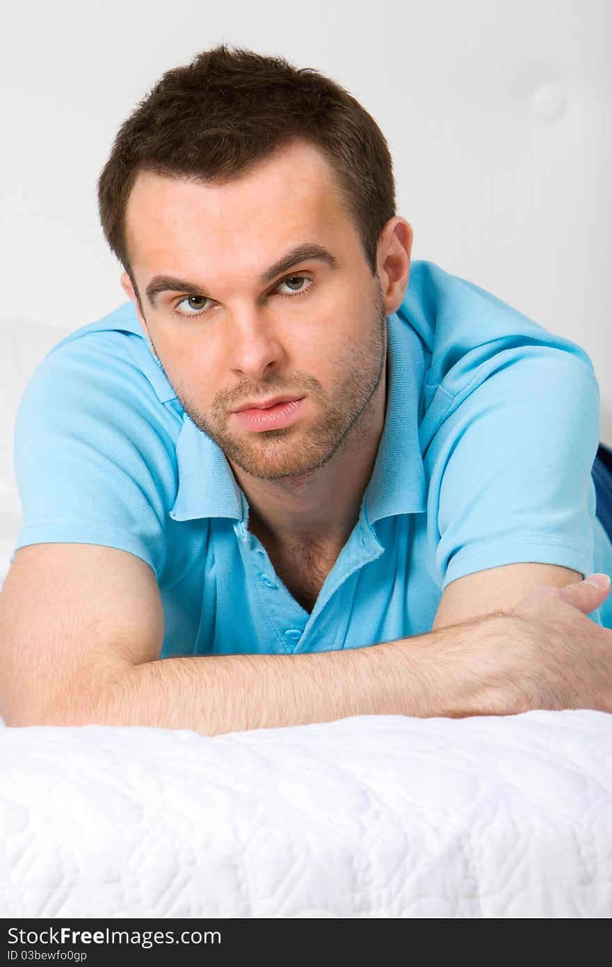 Young man portrair in white interior. Young man portrair in white interior