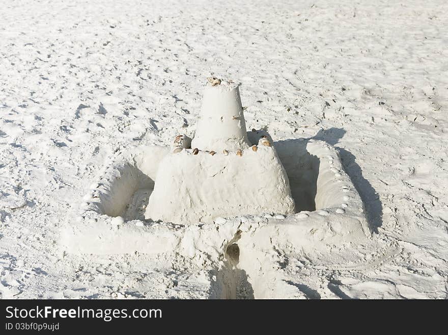 Sand castle on a sunny beach