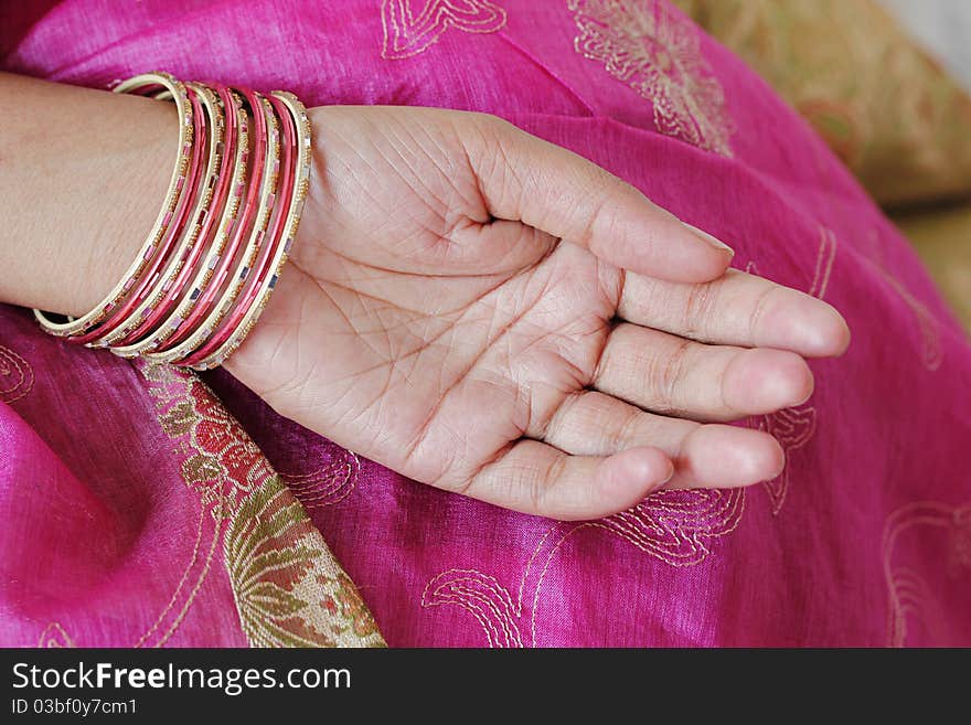 Traditional indian bangles worn by an indian woman. Traditional indian bangles worn by an indian woman