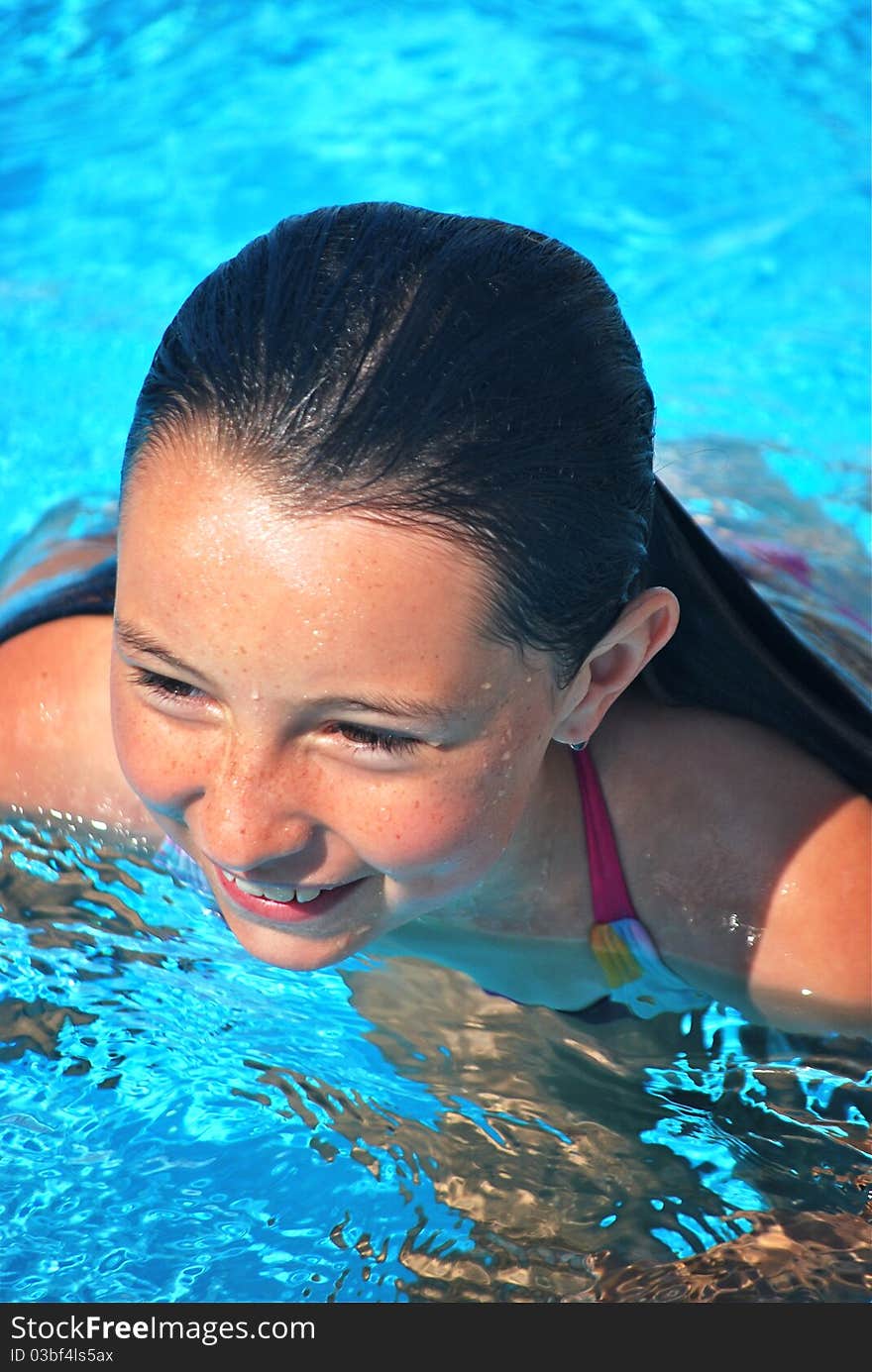 Head And Facial Shot Of Girl While In Pool