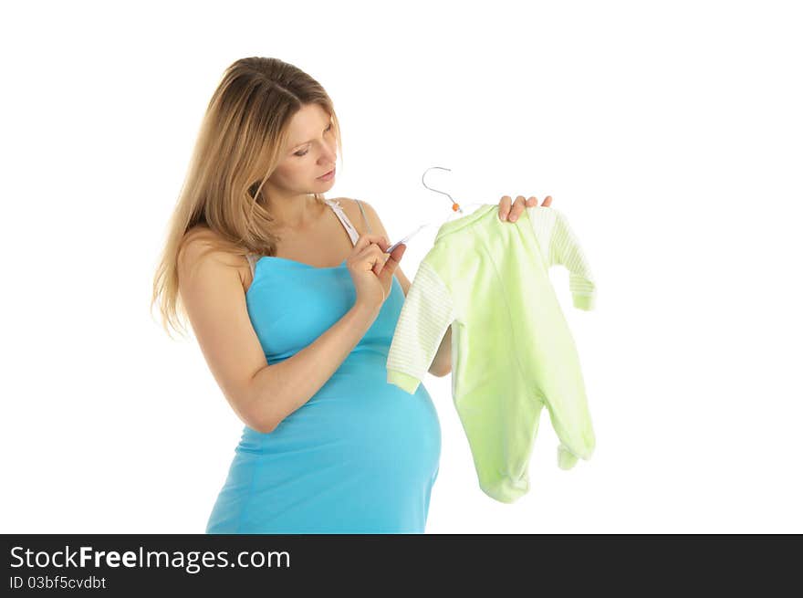 Pregnant woman buying baby clothes isolated on white