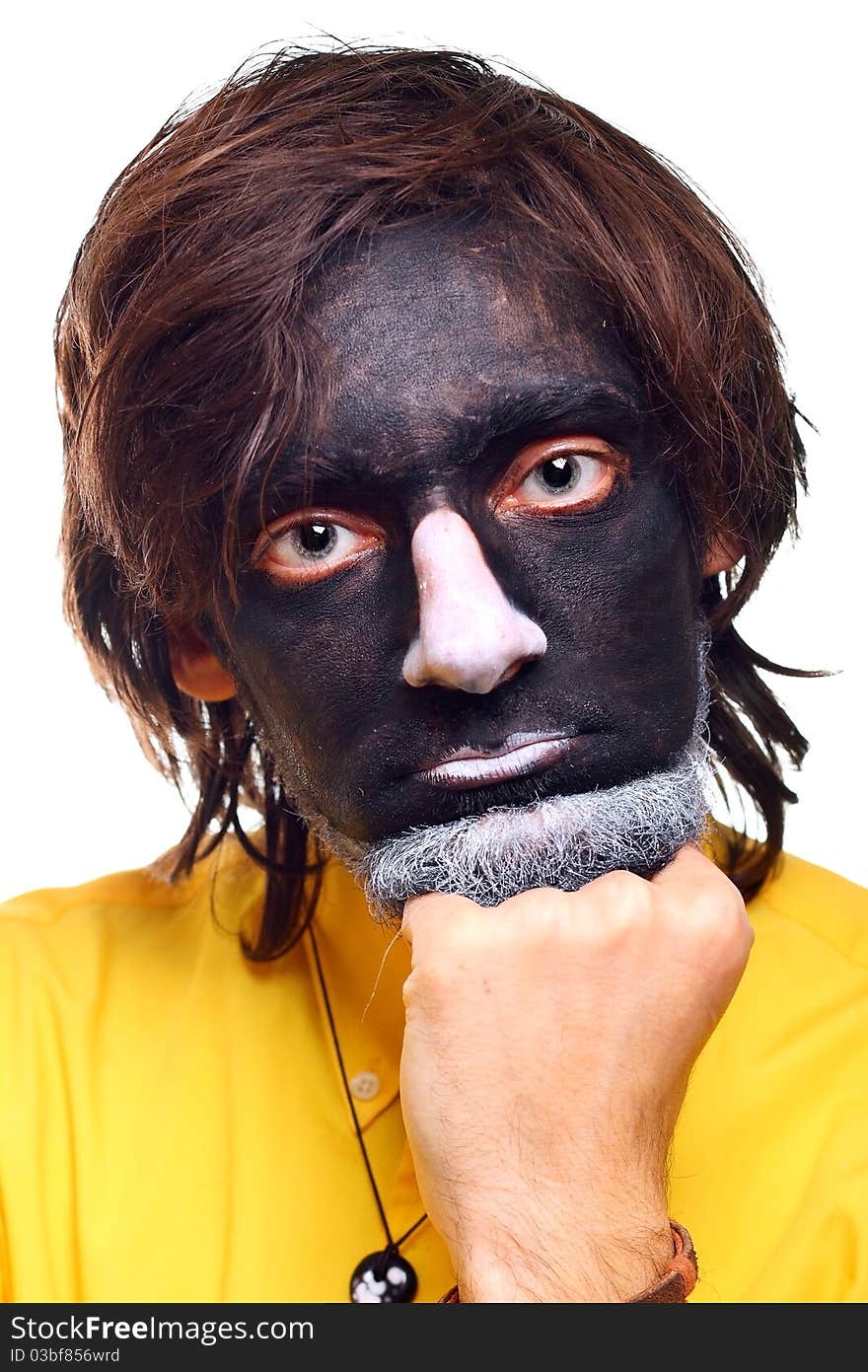 Portrait of a painted young man in studio. Portrait of a painted young man in studio