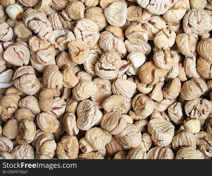 Dried chestnuts used as food ingredients in Chinese desserts and cuisine. For food and beverage, and nutritional concepts. closeup, background