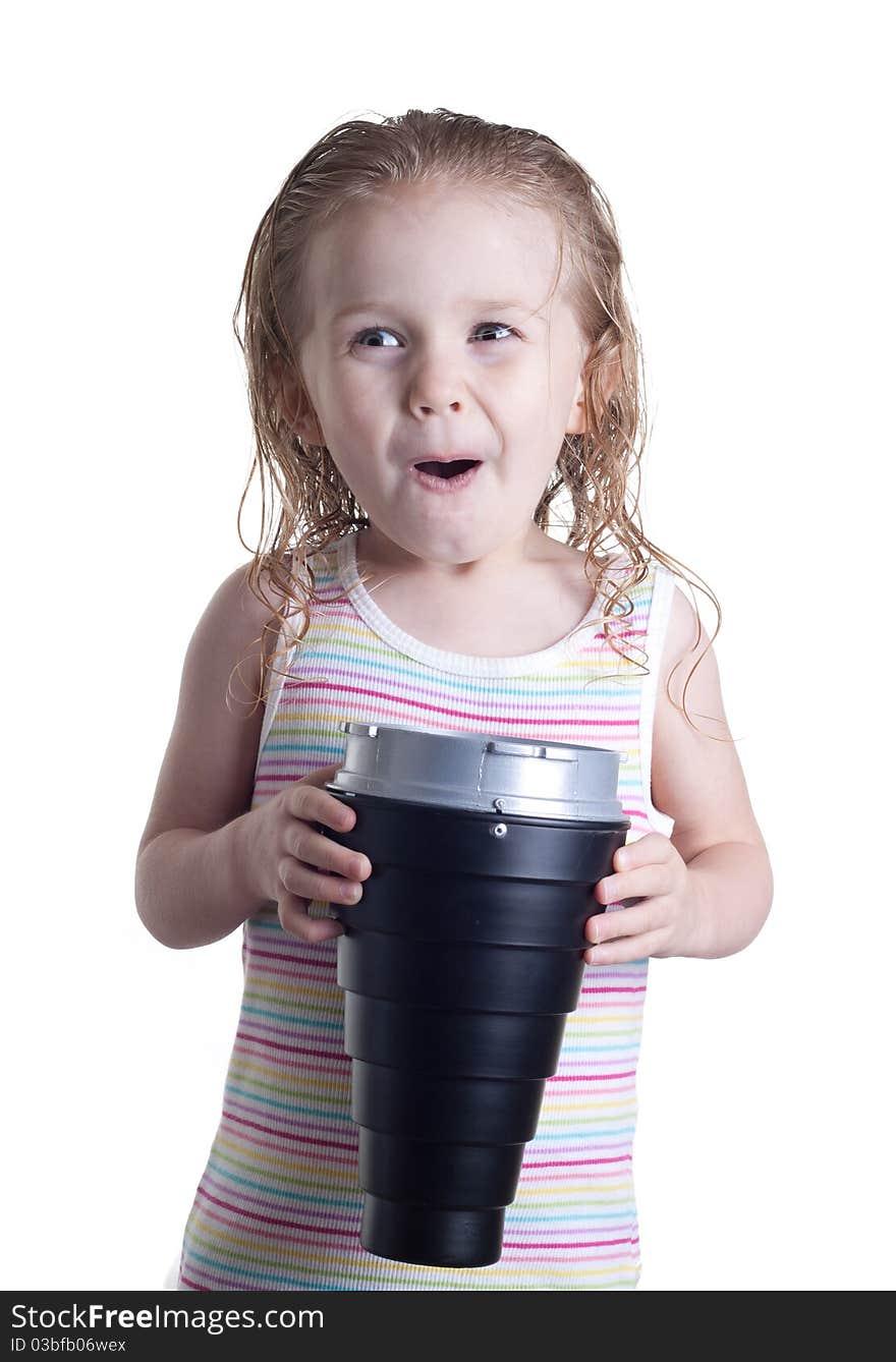 An excite young girl looking into a basket. The basket is glowing with a ball of light or something inside of it.