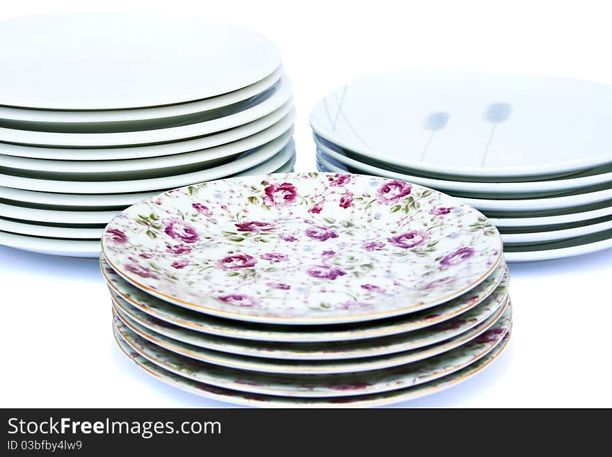 Stacks of plates isolated on white background.