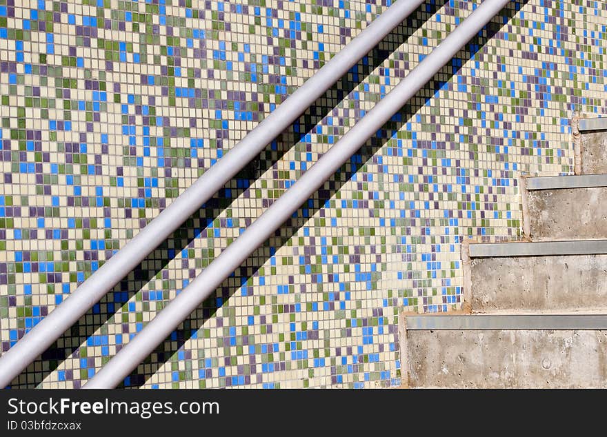 Modern external stairs and a colorful mosaic wall. Modern external stairs and a colorful mosaic wall.