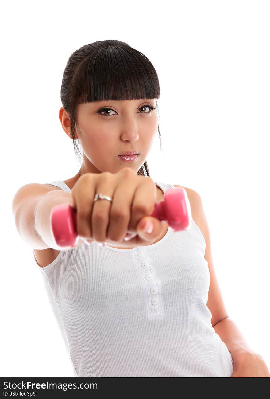 Beautiful young mixed race girl at the gym using hand weights.  She is looking directly at camera isolated on a white background. Beautiful young mixed race girl at the gym using hand weights.  She is looking directly at camera isolated on a white background.