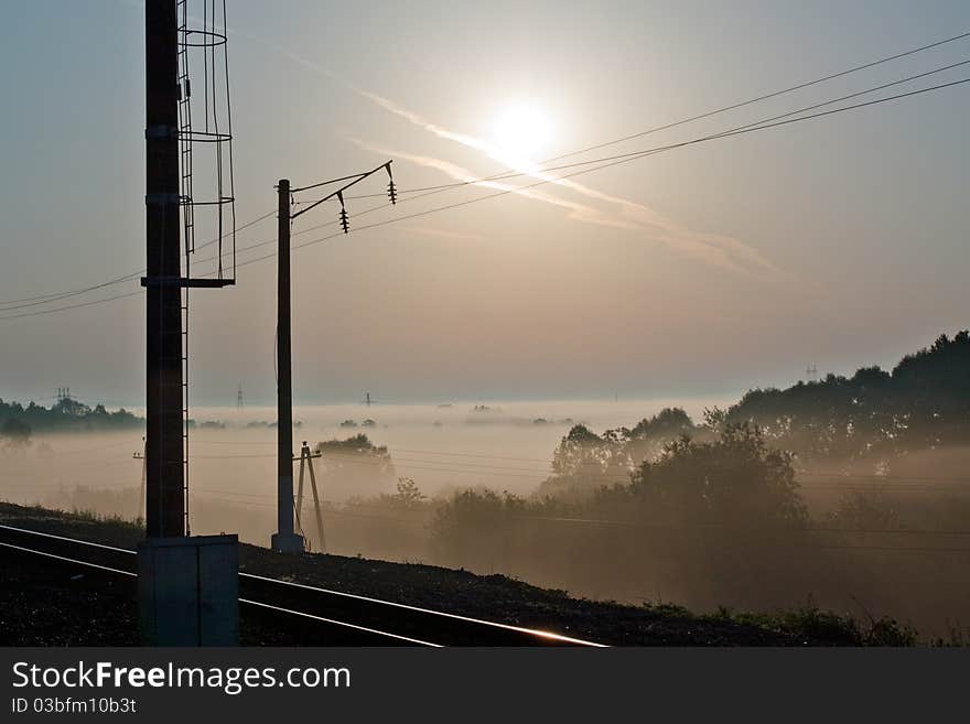 Sunrise over a misty meadow