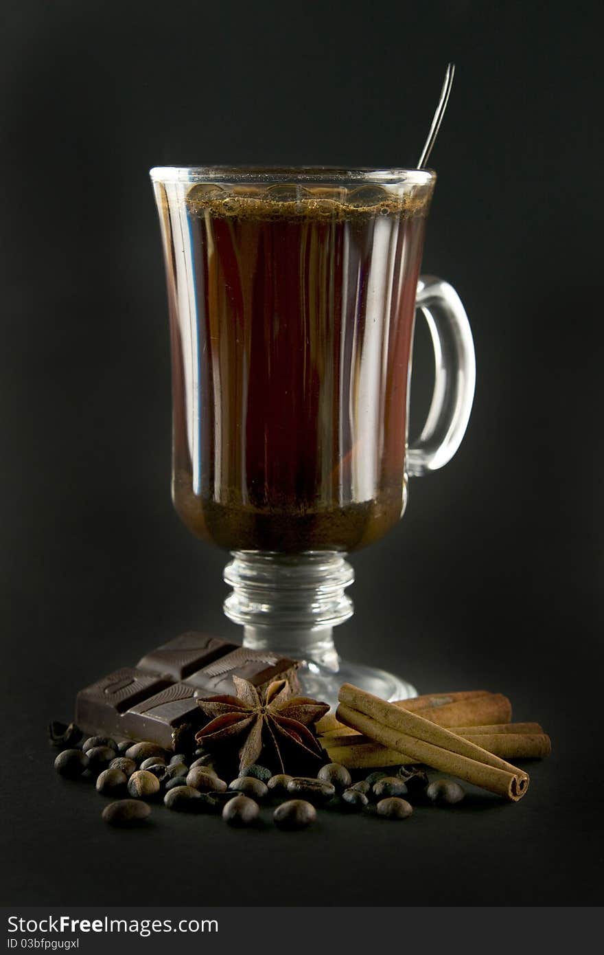 Cup of coffee and spice on black background. Cup of coffee and spice on black background.