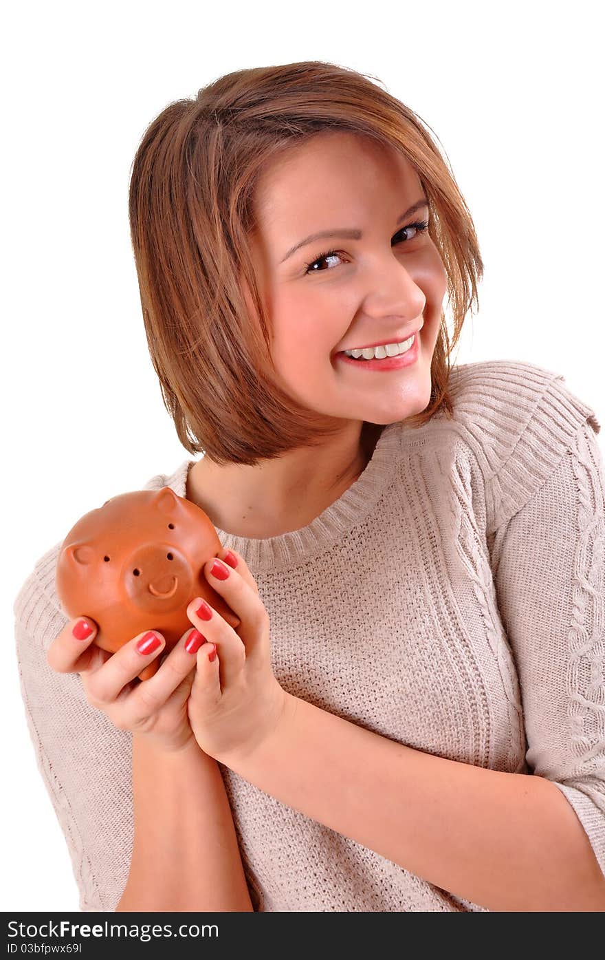 Smiling female holding piggy-bank