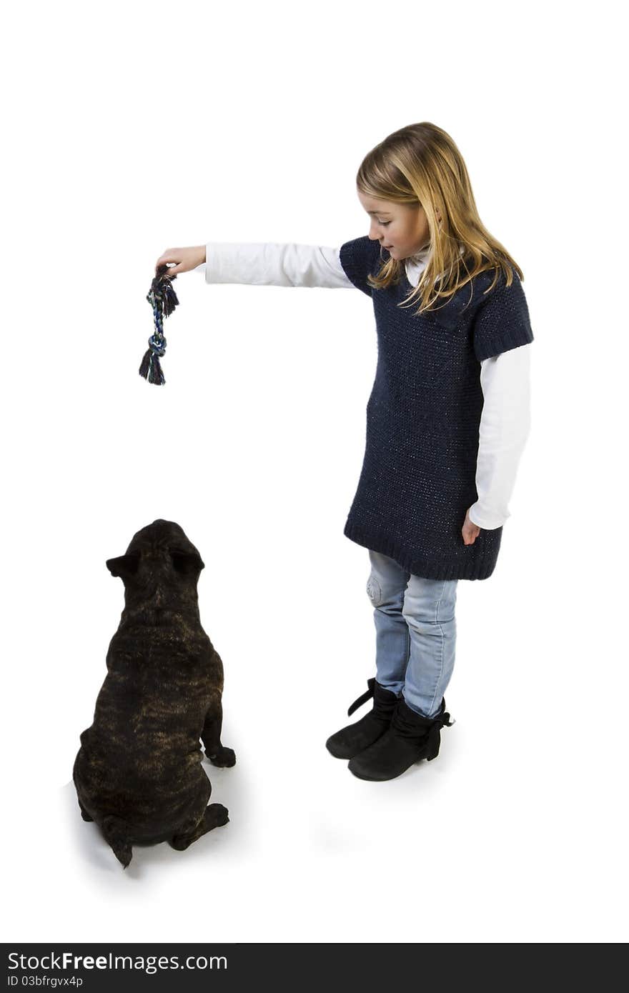 French bulldog and little girl playing