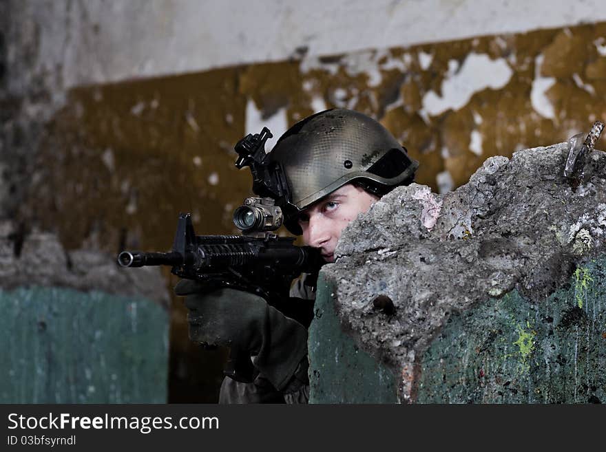 Young soldiers with guns during patrol