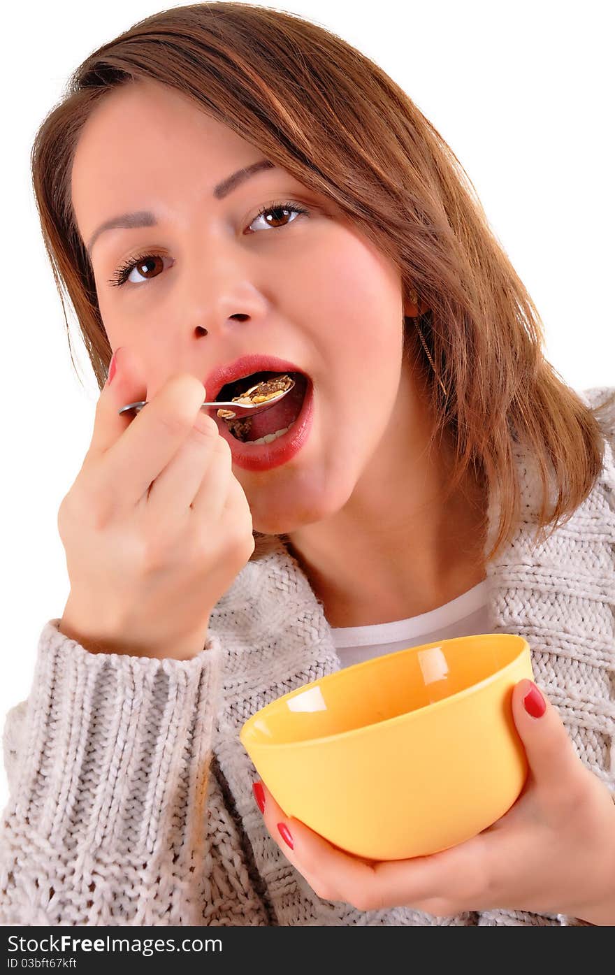 Happy young woman eating cereals