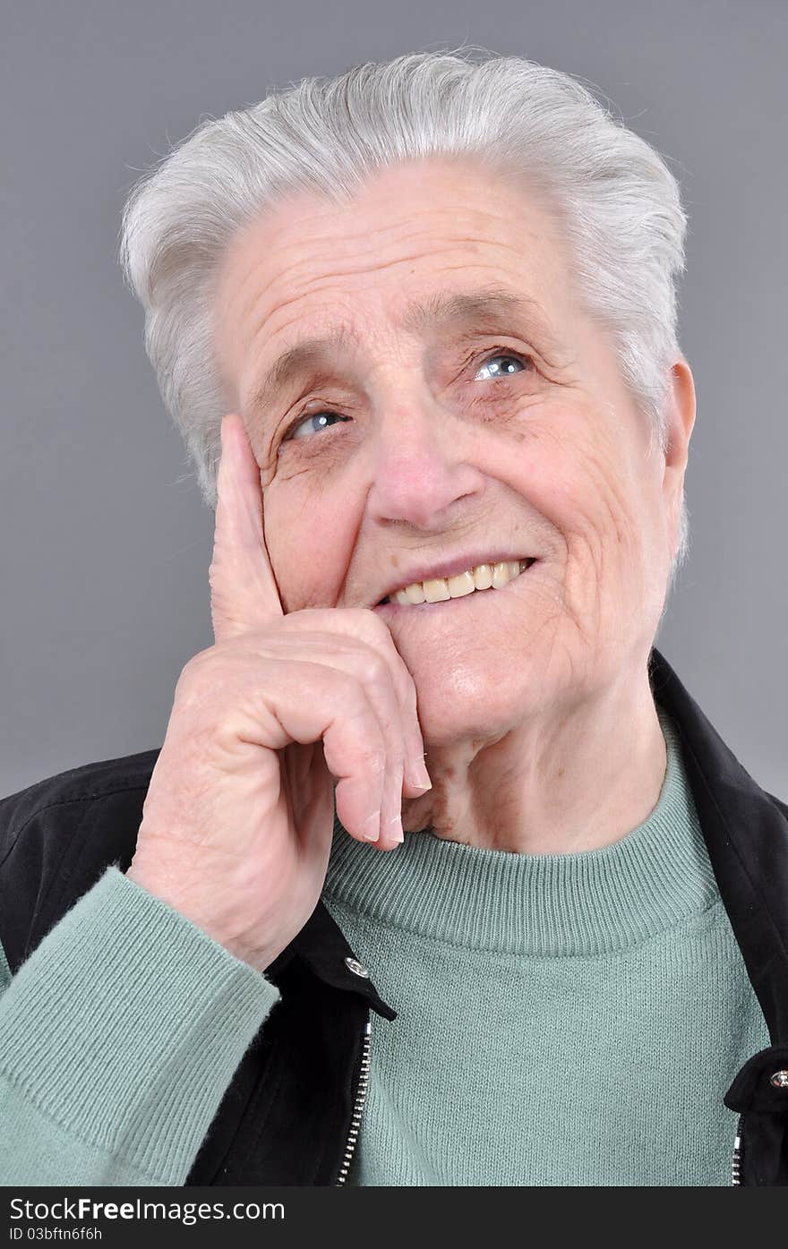 Old, attractive Caucasian woman thinking