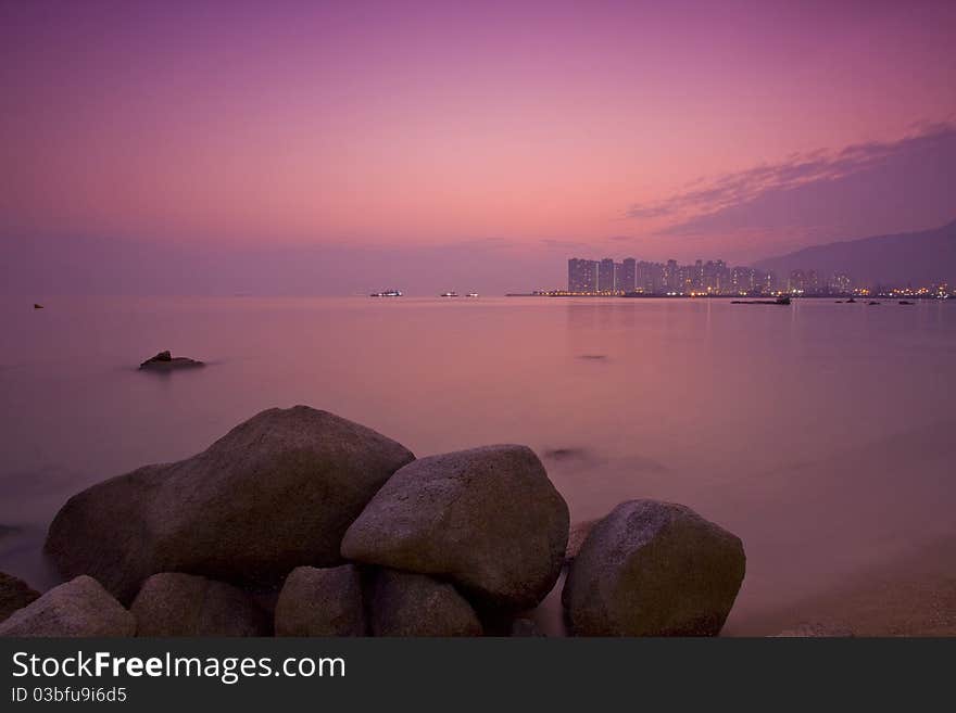 Sunset under long exposure along seashore