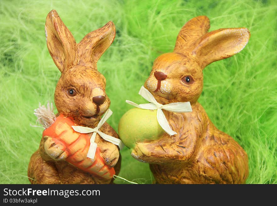 Cute easter bunnies with eggs in a nest. Cute easter bunnies with eggs in a nest.