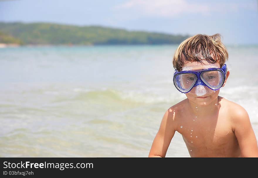 Boy In Diving Mask On Sea Background