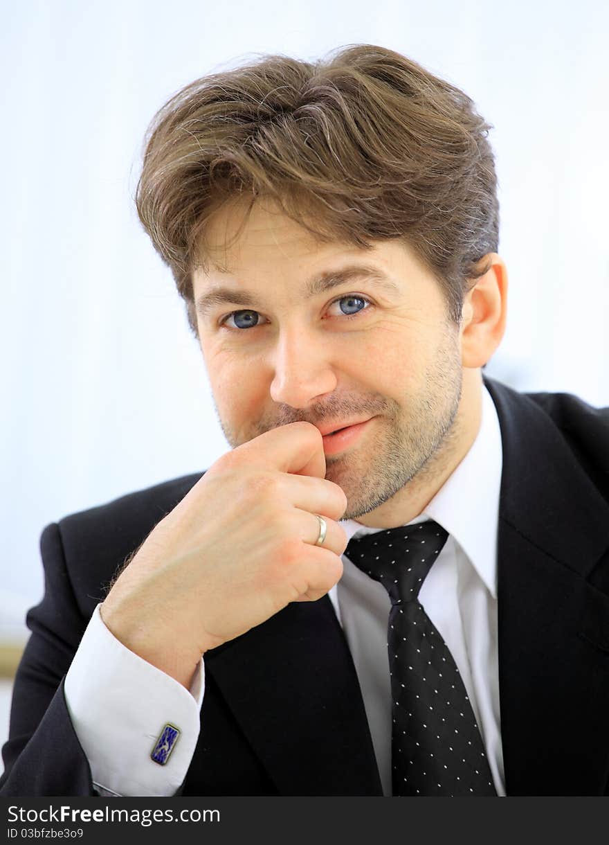 Portrait of smiling business man alone