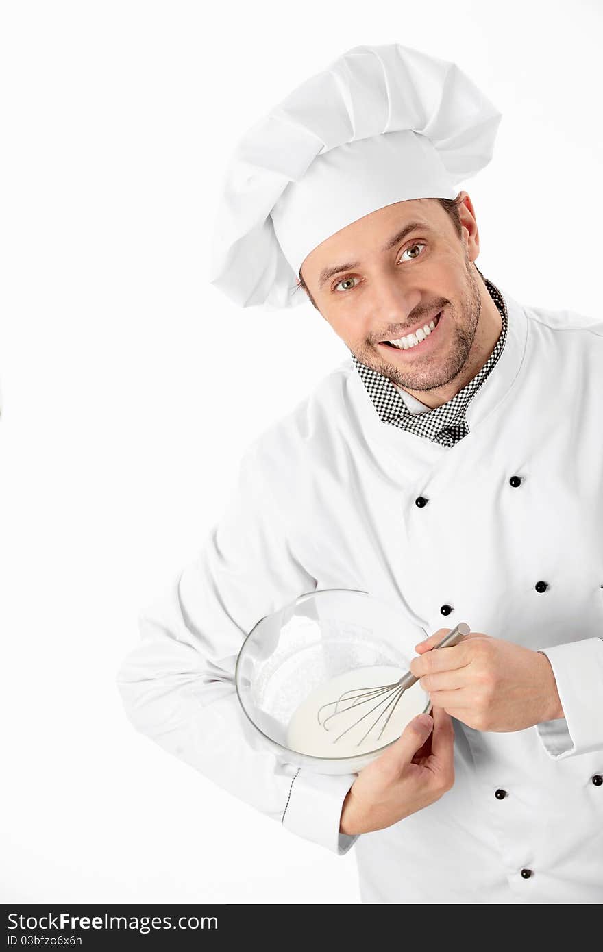 A cook prepares a white background. A cook prepares a white background