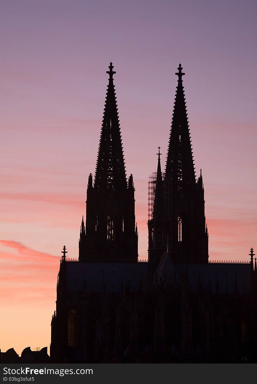 The spires of Cologne cathedral silhouetted against an October sunset