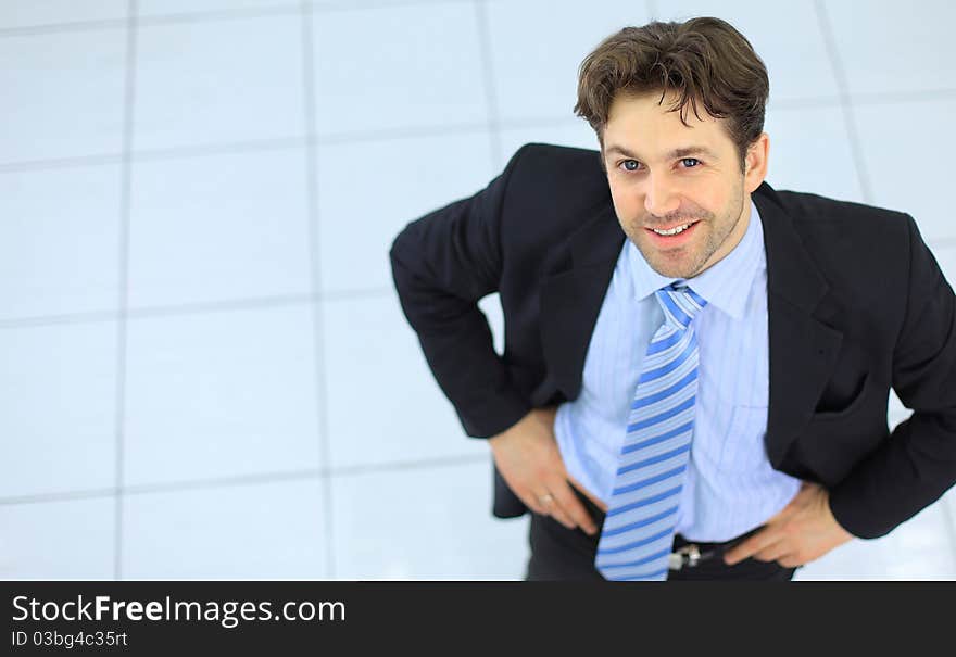 Portrait of a handsome elderly business man standing isolated on white background