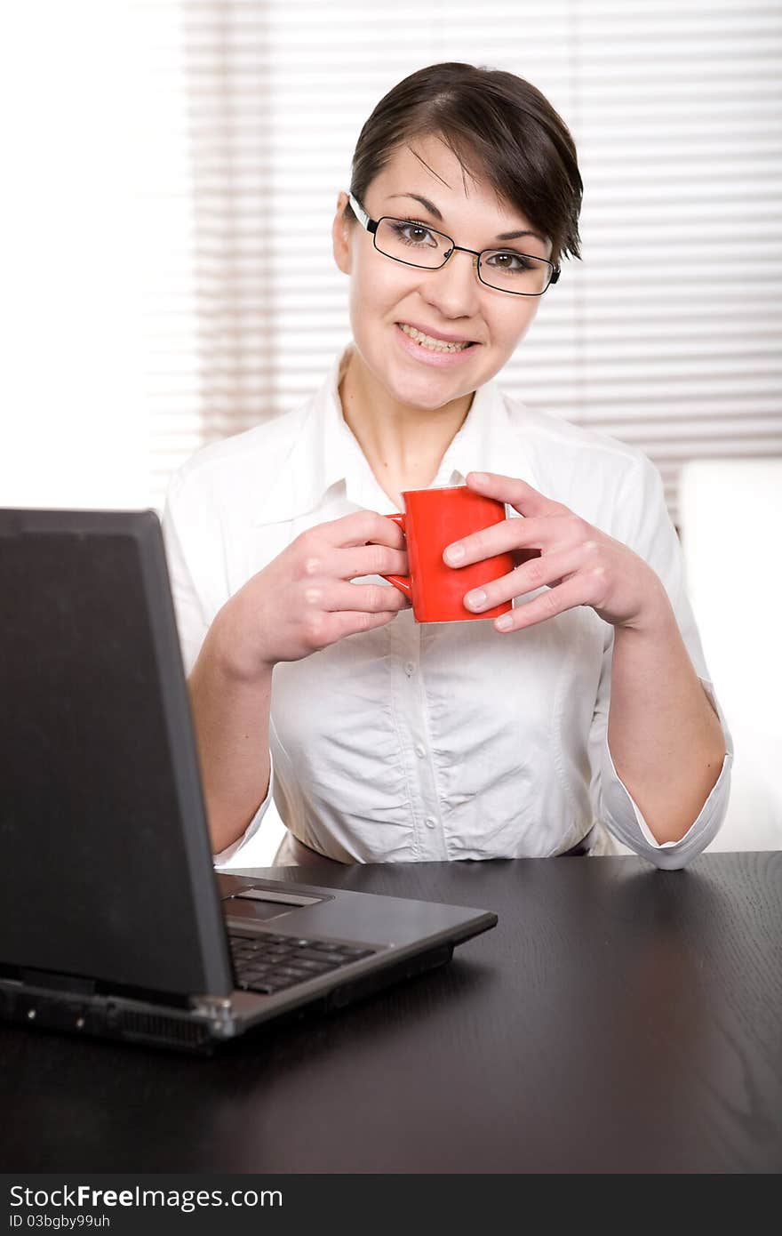 Young adult businesswoman at desk