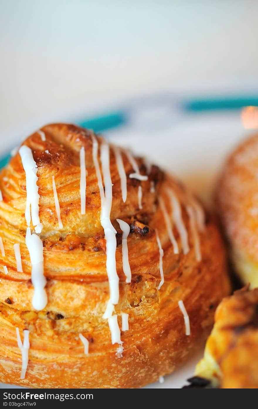 Closeup shot of freshly baked pastry on plate. Closeup shot of freshly baked pastry on plate.