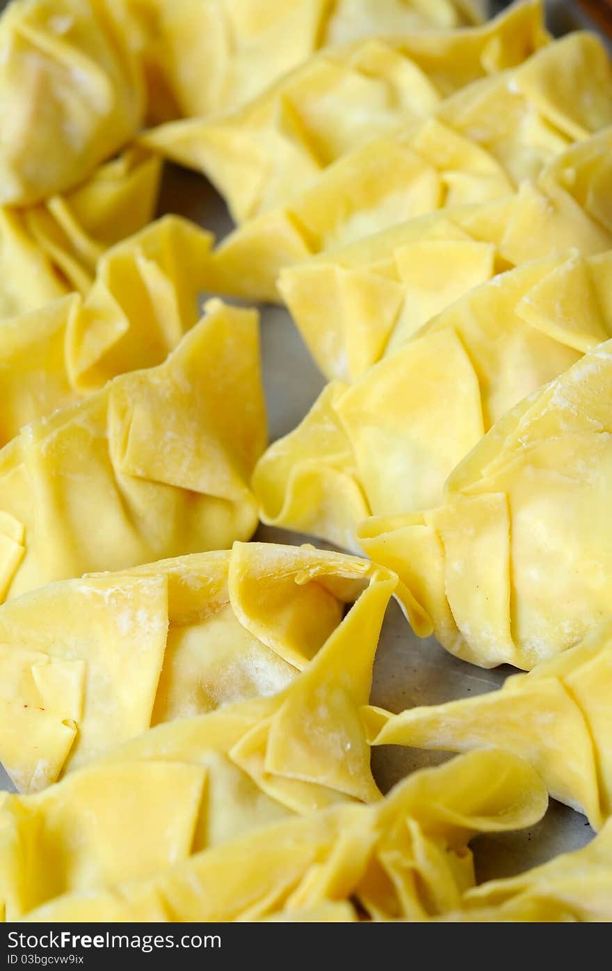 Fresh Oriental wanton dumplings ready to be cooked.