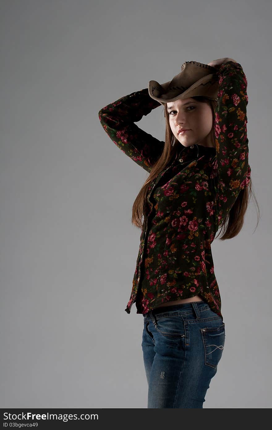 Attractive cowgirl portrait on white background