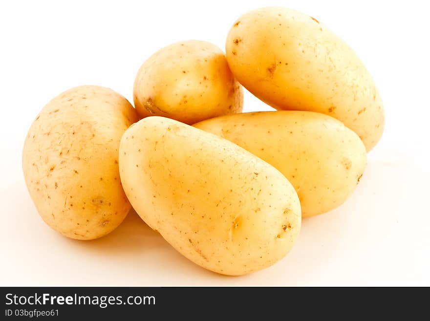 Young, fresh potatoes are isolated on a white background. Young, fresh potatoes are isolated on a white background