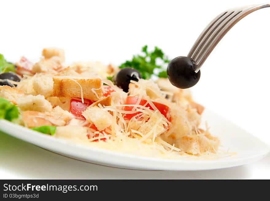 A salad in a stylish white bowl. A salad in a stylish white bowl.