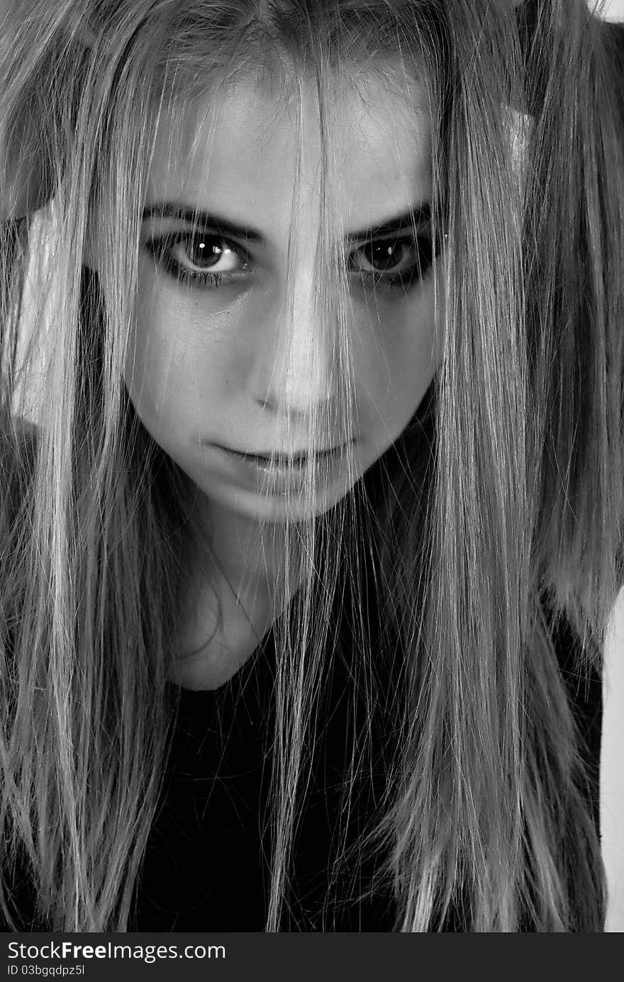 Black and white portrait of a misterious teenage girl. Black and white portrait of a misterious teenage girl