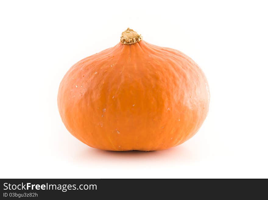 A fresh orange pumpkin on white background