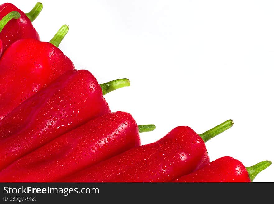 Crisp red peppers on a white background. Crisp red peppers on a white background