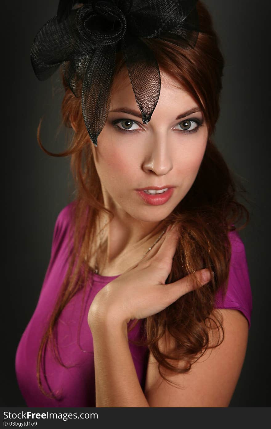 young woman on dark background