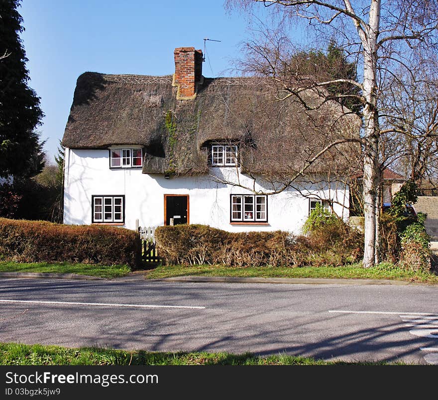 Thatched Village Cottage next to a road