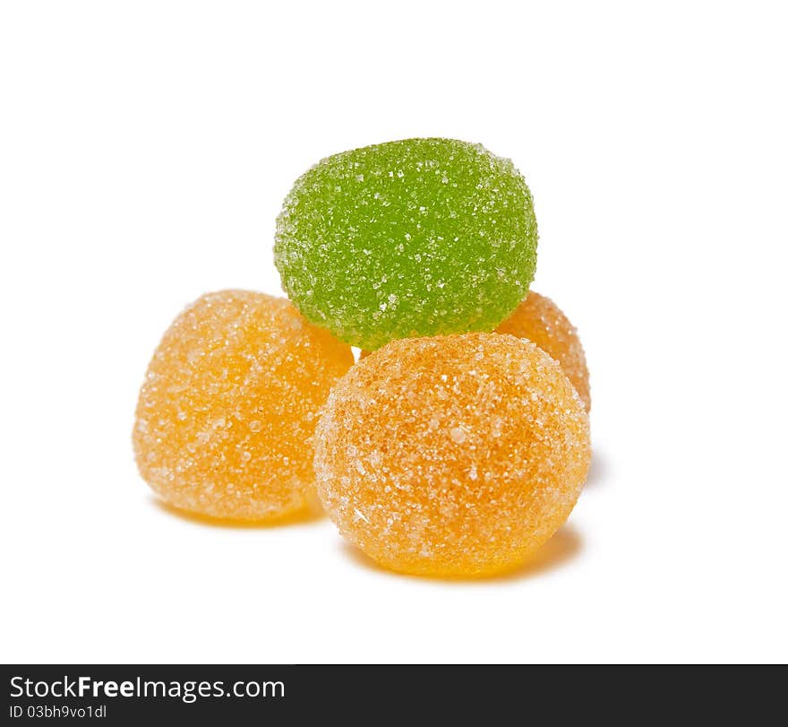 Jujube in sugar isolated over white. Focus is pointed on a green piece