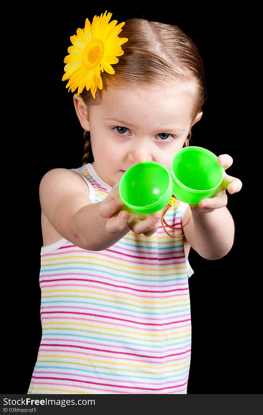 A young girl seems upset because her egg is empty. A young girl seems upset because her egg is empty.