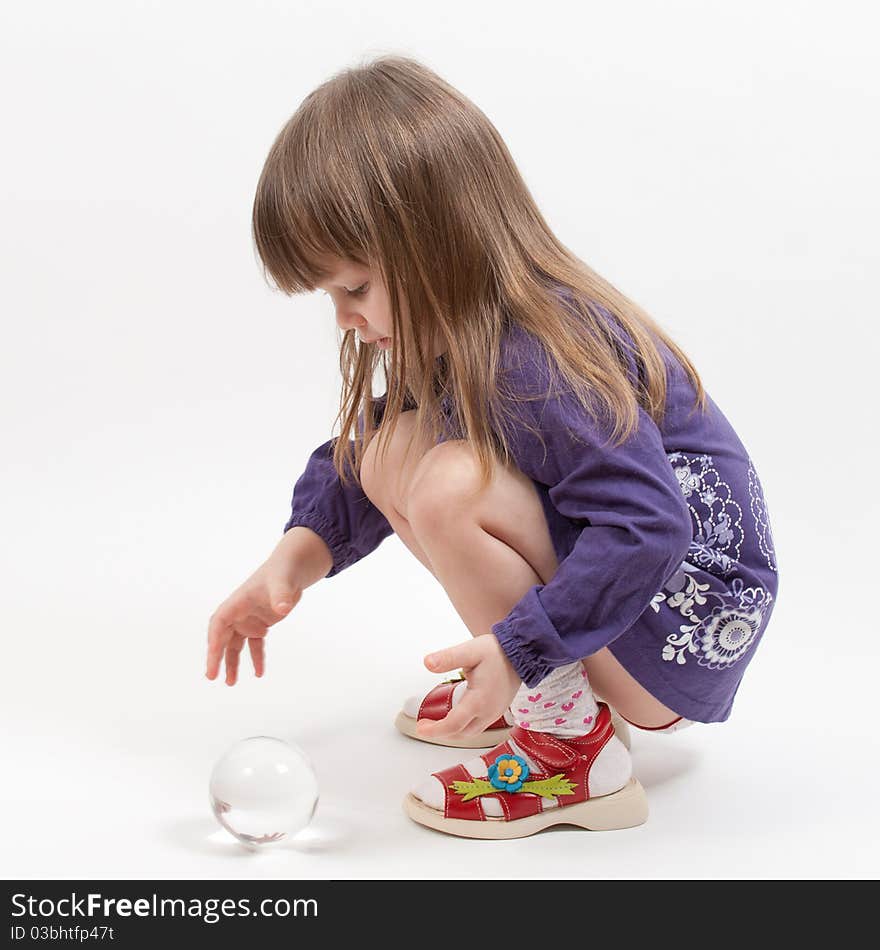 Young girl sit with glass bowl in purple dress. Young girl sit with glass bowl in purple dress