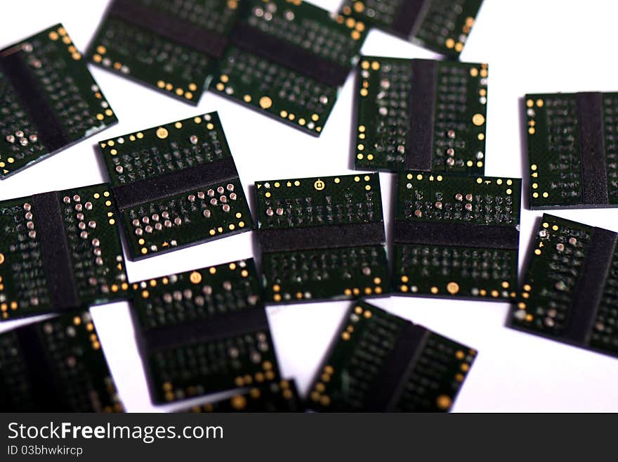 Close view of a bunch of computer memory chips isolated on a white background.