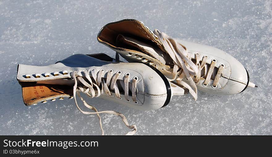 Women white skates on ice. Women white skates on ice