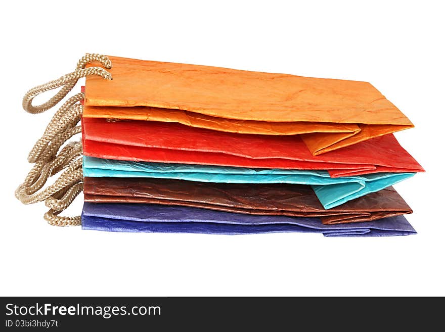 Five color paper bags isolated on the white background